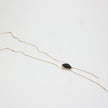 Elemental Pebble Necklace — handmade brass necklace with organic pebble pendant, product shot on white background