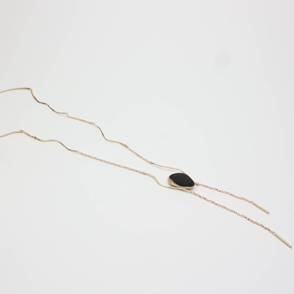 Elemental Pebble Necklace — handmade brass necklace with organic pebble pendant, product shot on white background