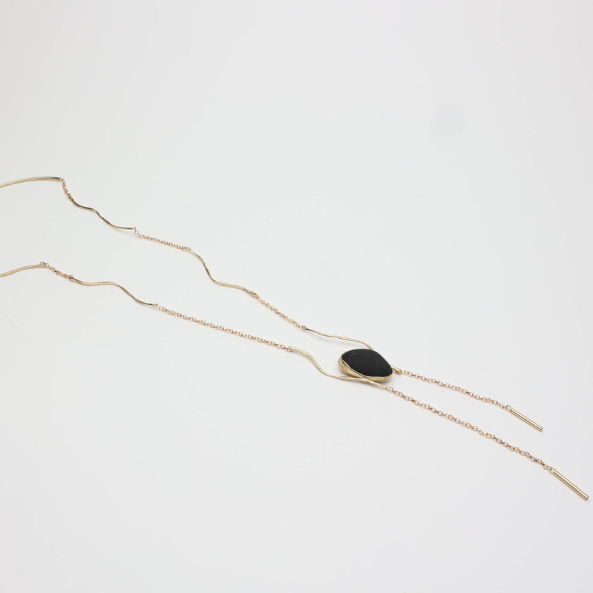 Elemental Pebble Necklace — handmade brass necklace with organic pebble pendant, product shot on white background