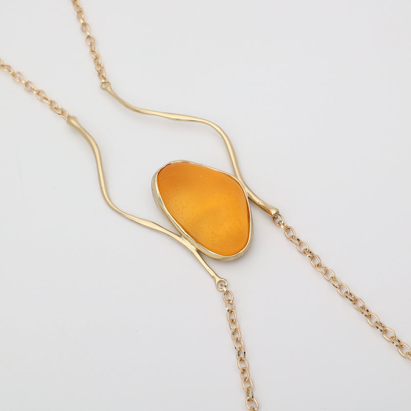 Elemental Pebble Necklace — handmade brass wavy link necklace, straight on white background