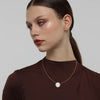 Kiss Necklace — handmade brass wire necklace with round resin stone pendant on model