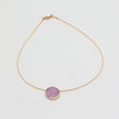 Kiss Necklace — handmade brass wire necklace with round resin stone pendant, front view on white background