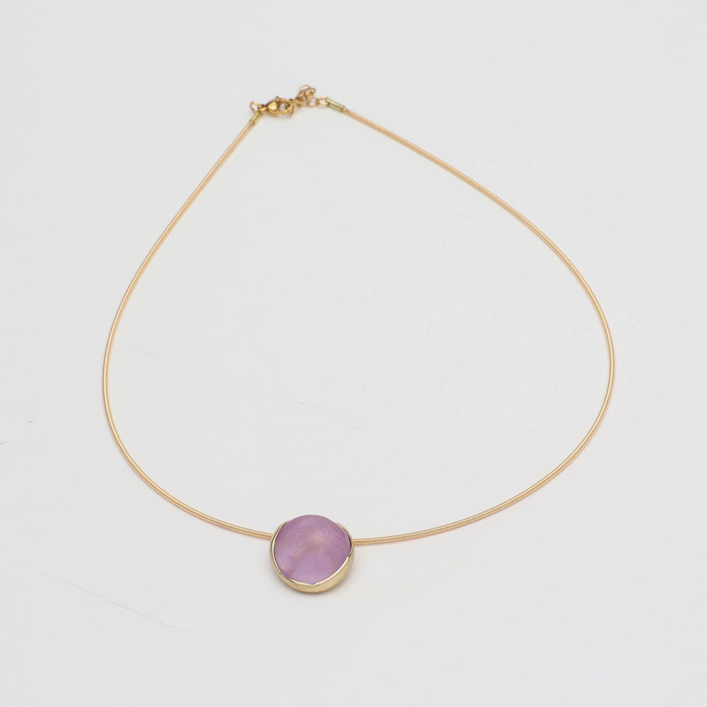 Kiss Necklace — handmade brass wire necklace with round resin stone pendant, front view on white background