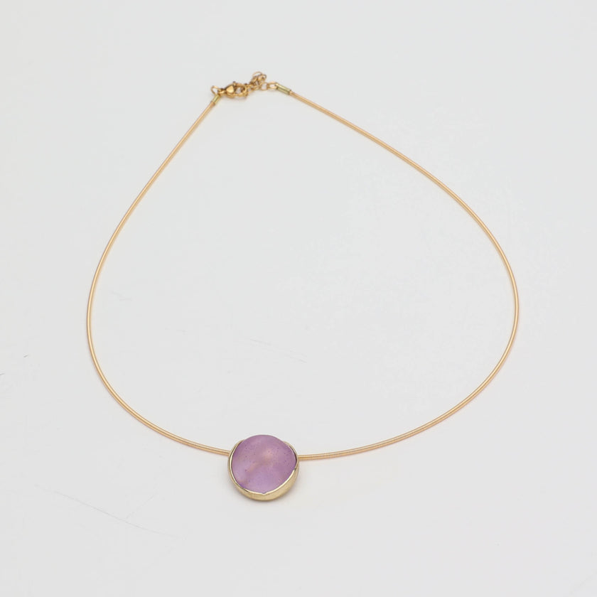 Kiss Necklace — handmade brass wire necklace with round resin stone pendant, front view on white background