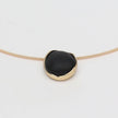 Kiss Necklace — handmade brass choker necklace laid flat on white background, full view