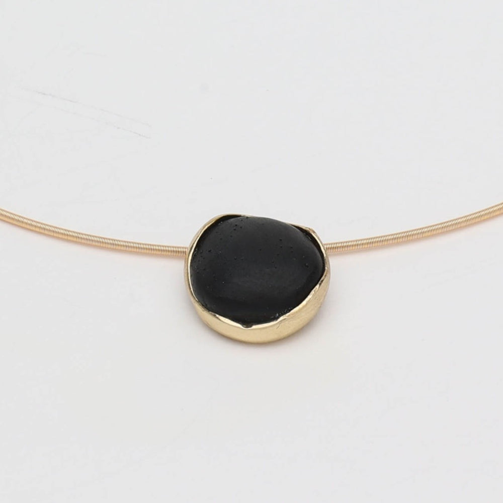 Kiss Necklace — handmade brass choker necklace laid flat on white background, full view