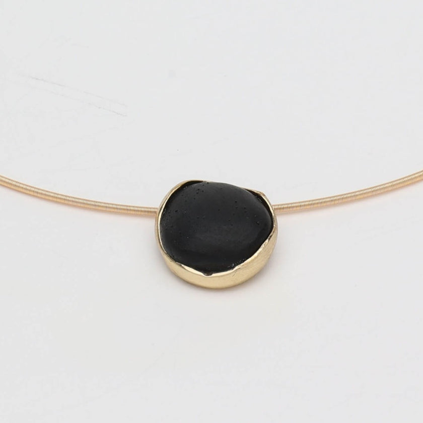 Kiss Necklace — handmade brass choker necklace laid flat on white background, full view