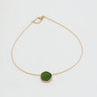Kiss Necklace — handmade brass wire necklace with organic pebble pendant, product shot on white background