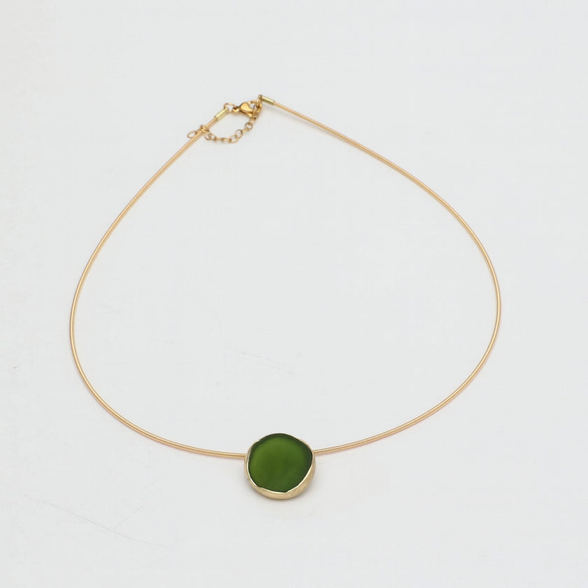 Kiss Necklace — handmade brass wire necklace with organic pebble pendant, product shot on white background