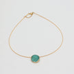 Kiss Necklace — handmade brass necklace with resin stone centerpiece, clasp detail on white background