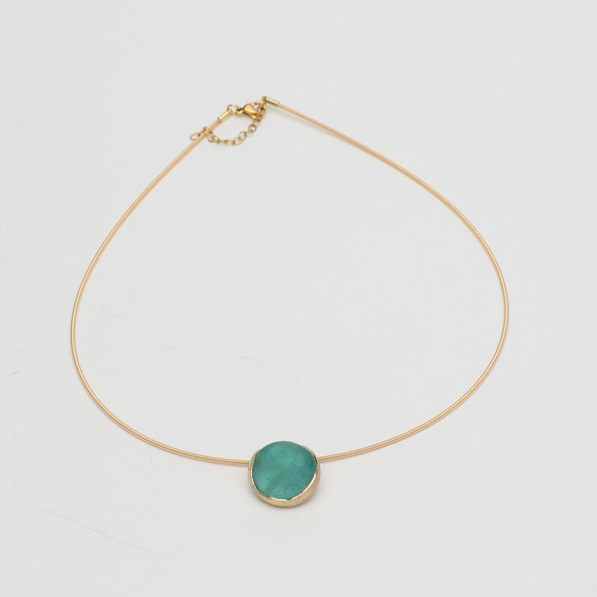 Kiss Necklace — handmade brass necklace with resin stone centerpiece, clasp detail on white background