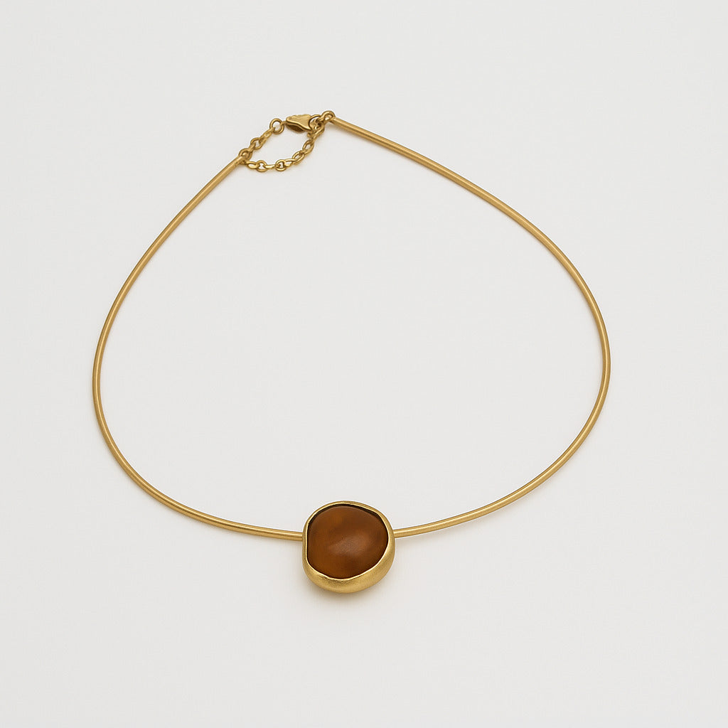 Kiss Necklace view — handmade brass wire necklace with sculptural pebble pendant