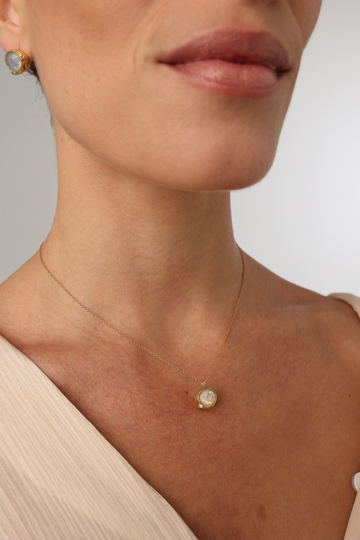 Billy Necklace close-up on model — handmade brass gemstone pendant necklace