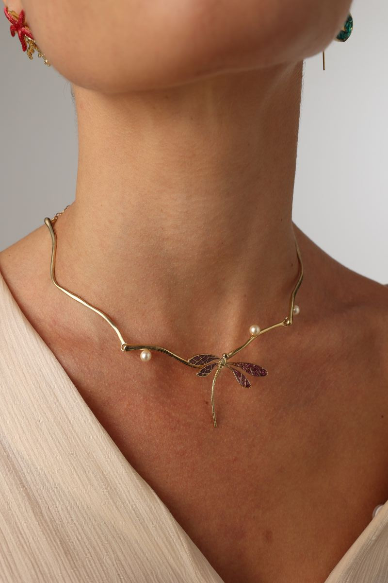 Buzz Necklace on model — artisan brass branch necklace with enamel dragonfly and pearl accents