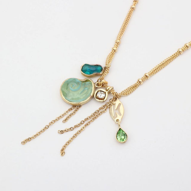 Shelly Necklace flat lay — bohemian multi-strand charm necklace, handmade jewelry made in Greece