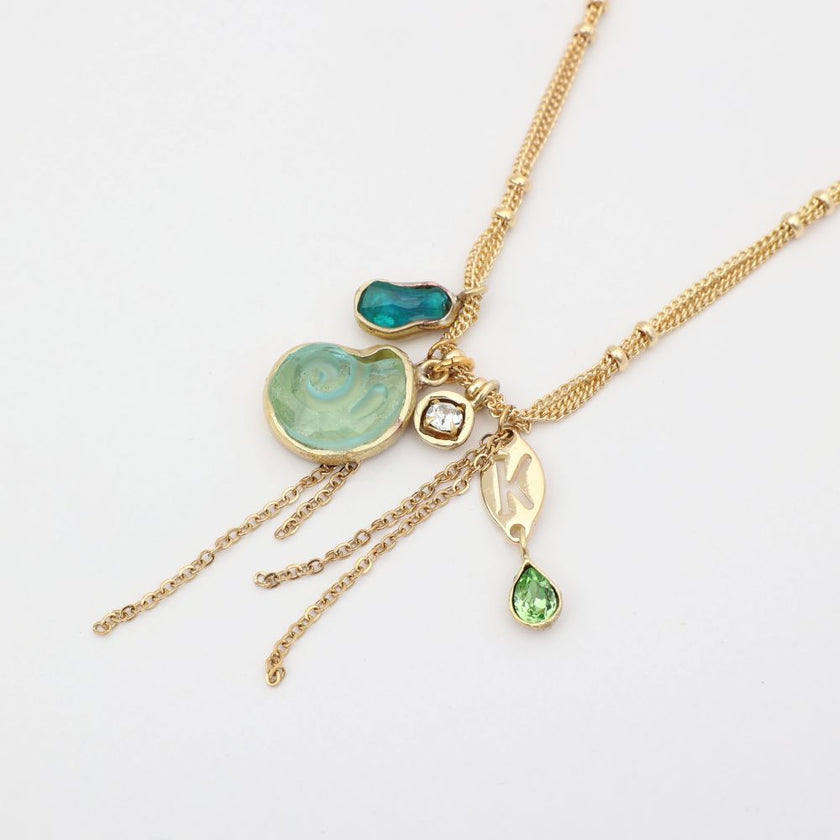 Shelly Necklace flat lay — bohemian multi-strand charm necklace, handmade jewelry made in Greece