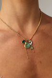 Shelly Necklace — handmade brass jewelry gemstone charm necklace with sea tokens on model