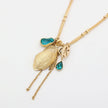 Charmy Limpet Necklace flat lay — bohemian multi-strand charm necklace, handmade jewelry made in Greece