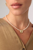 Tide Necklace — handmade pearl necklace with starfish and scallop shell charm on model