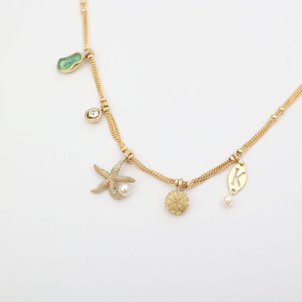 Charmy Tide Necklace close-up — artisan brass charm necklace, boho jewelry made in Greece