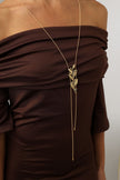 handmade brass sculptural botanical pendant with crystal accent on wire chain
