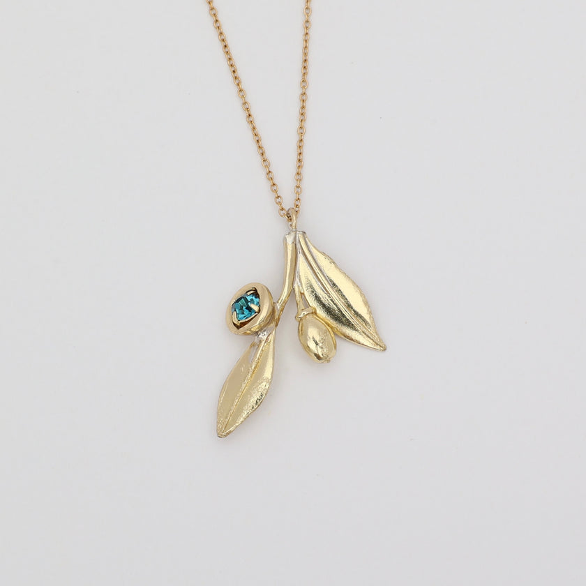 Alea Necklace product shot — handmade brass nature-inspired pendant necklace from the Olive Tales collection