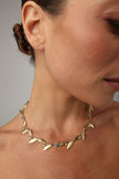 handmade brass botanical necklace with bezel-set crystals worn on neck