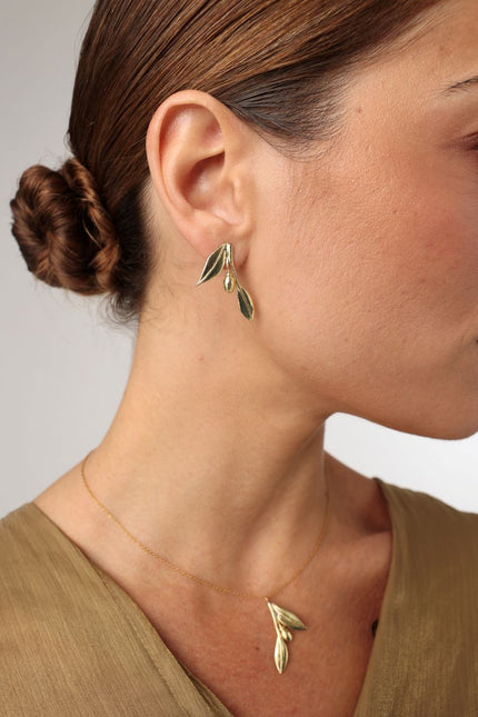 Lio Necklace — handmade brass olive branch pendant necklace with sculptural leaf and olive motifs on white background
