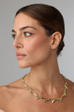 Selia Necklace — handmade brass olive branch statement necklace with sculpted leaf and olive fruit chain on white background
