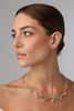 Selia Necklace — handmade brass olive branch statement necklace with sculpted leaf and olive fruit chain on white background
