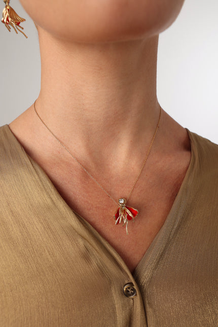 Iria Necklace in red enamel — handmade brass statement pendant necklace worn on model
