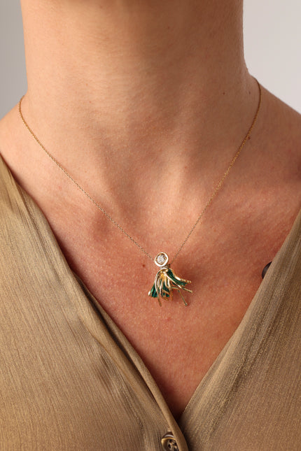 Iria Necklace in green enamel — handmade brass sculptural pendant necklace on model
