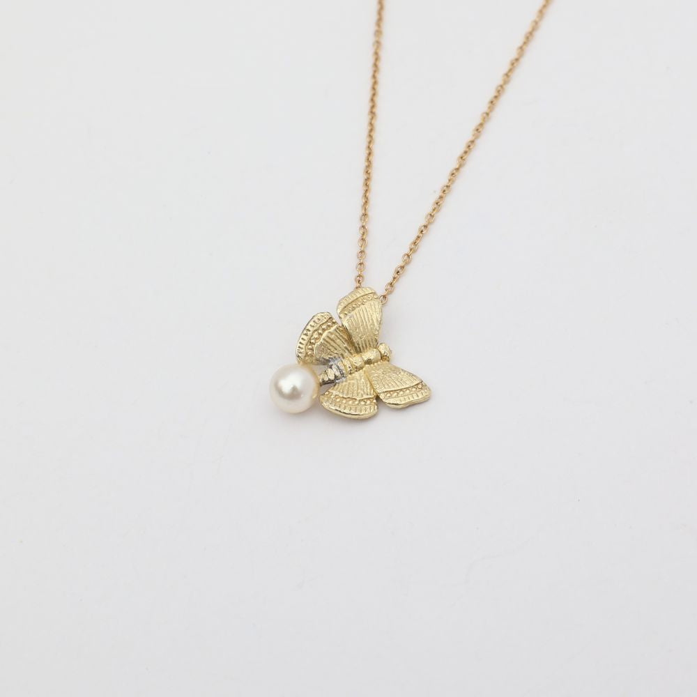 Elys Necklace — handmade brass butterfly necklace with freshwater pearl pendant, made in Greece