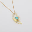 Flutter Necklace — artisan brass pendant necklace with faceted blue gemstone