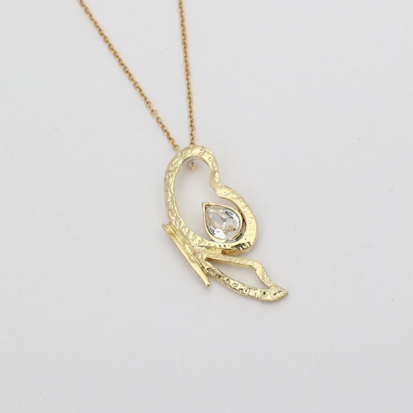 Flutter Necklace — handmade brass open-form pendant necklace with clear crystal stone