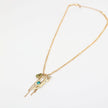Gold necklace with a pendant on a white background