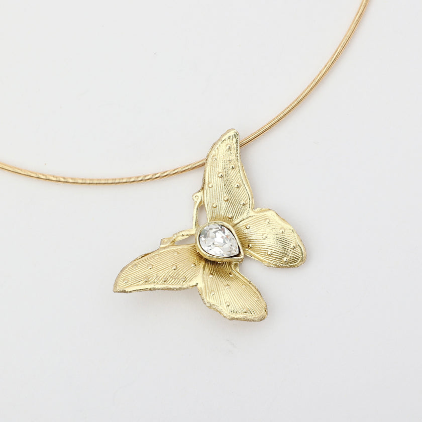 Nymia Necklace on model — handmade brass butterfly gemstone statement necklace on rigid wire chain