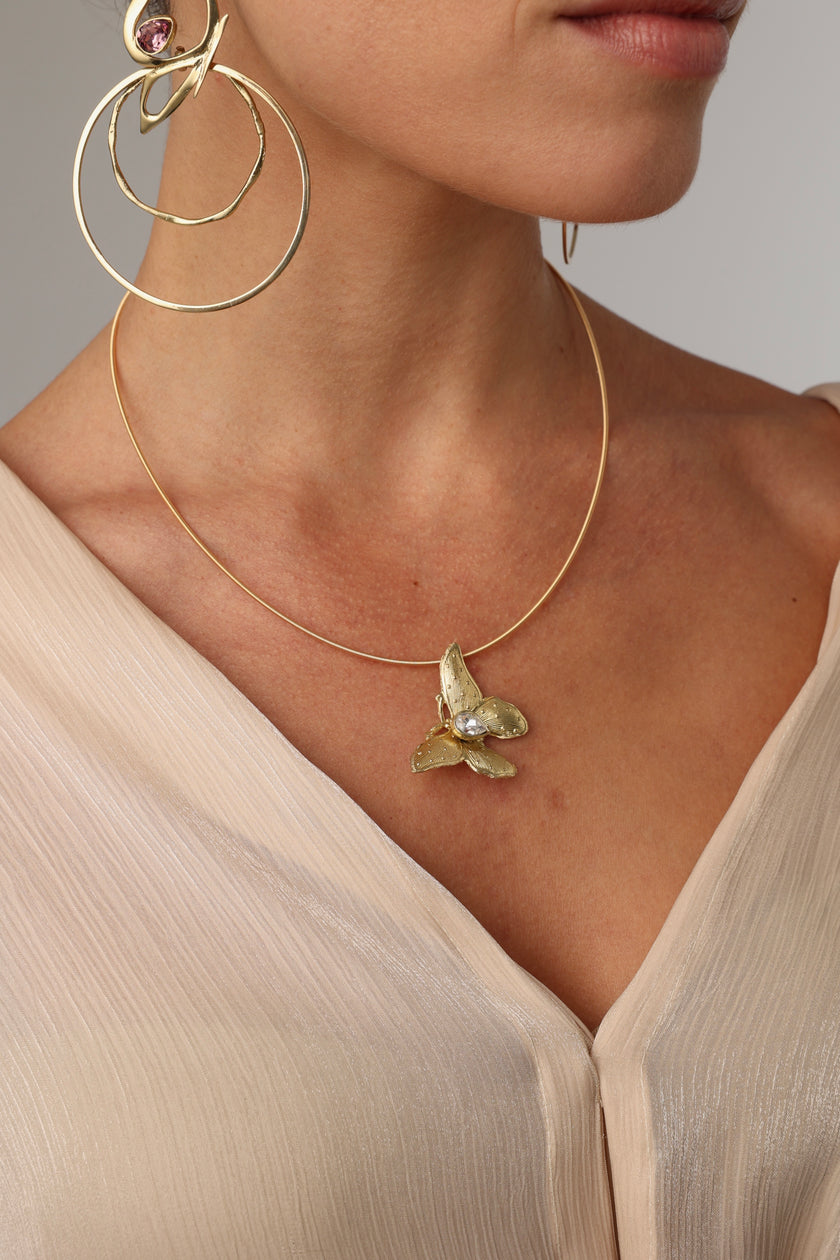 Nymia Necklace — sculptural brass butterfly necklace with crystal teardrop gemstone on wire chain