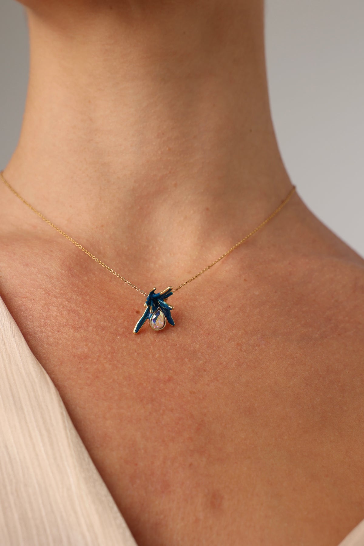 Small handmade brass coral pendant with a teardrop crystal and colorful enamel, handcrafted in Greece