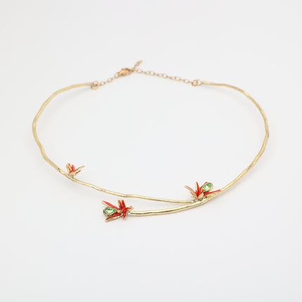 Handmade brass branch choker with red floral enamel and green crystals, handcrafted in Greece.