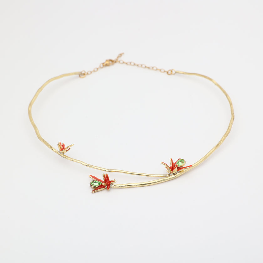 Handmade brass branch choker with red floral enamel and green crystals, handcrafted in Greece.