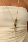 Dragonfish Necklace — handmade brass long lariat necklace with sculptural pendant and verdigris patina on model, full length