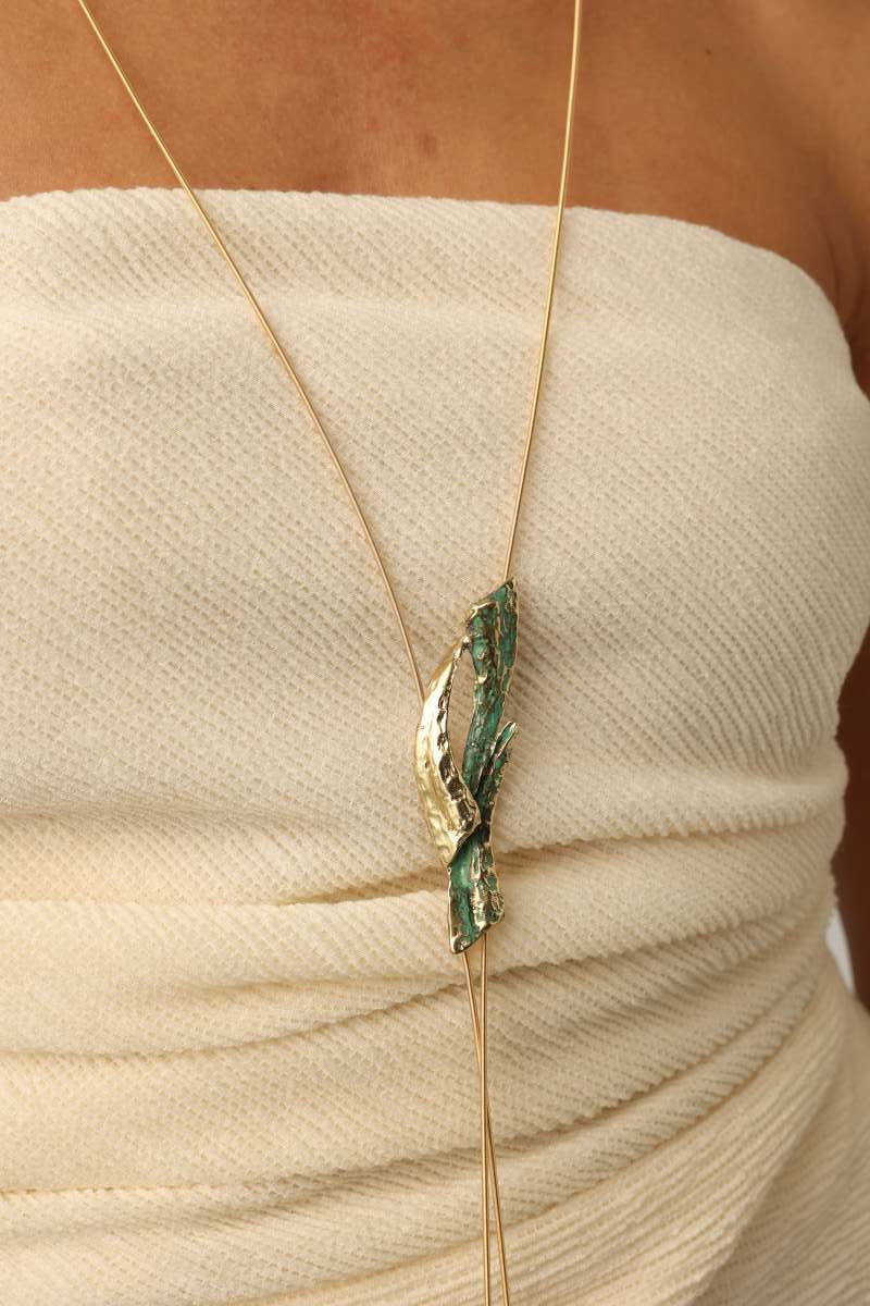 Dragonfish Necklace — handmade brass long lariat necklace with sculptural pendant and verdigris patina on model, full length