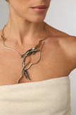 Dragon Necklace — handmade brass wave collar statement necklace with sculptural creature pendant on model, full chest view