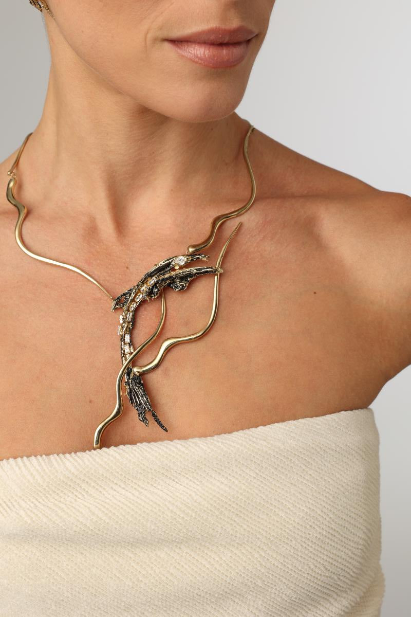 Dragon Necklace — handmade brass wave collar statement necklace with sculptural creature pendant on model, full chest view
