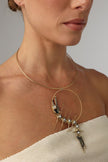 Draco Necklace close-up ,  artisan brass necklace with abstract circular pendant and textured details
