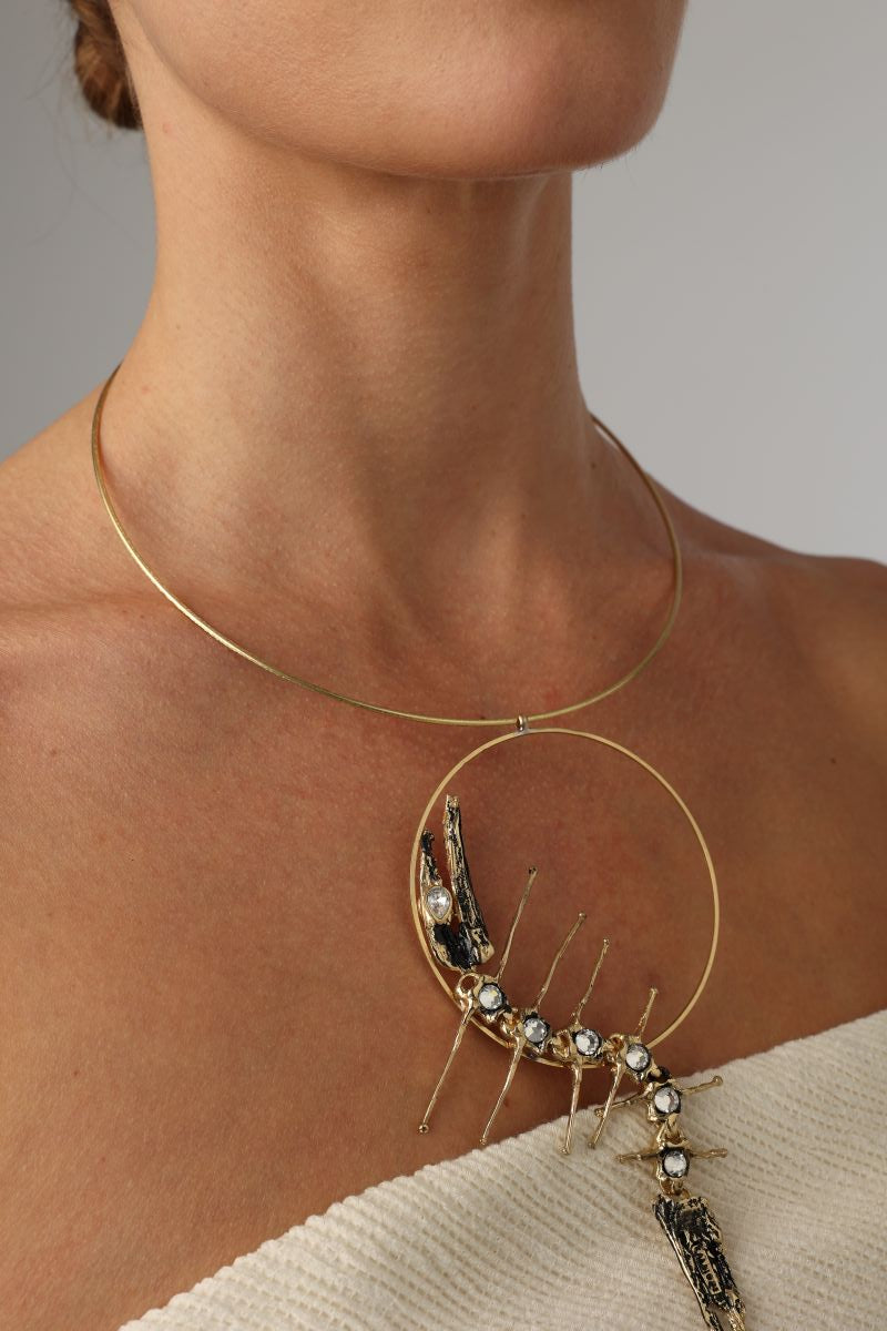 Draco Necklace , handmade brass statement necklace with sculptural dragon-inspired pendant on model