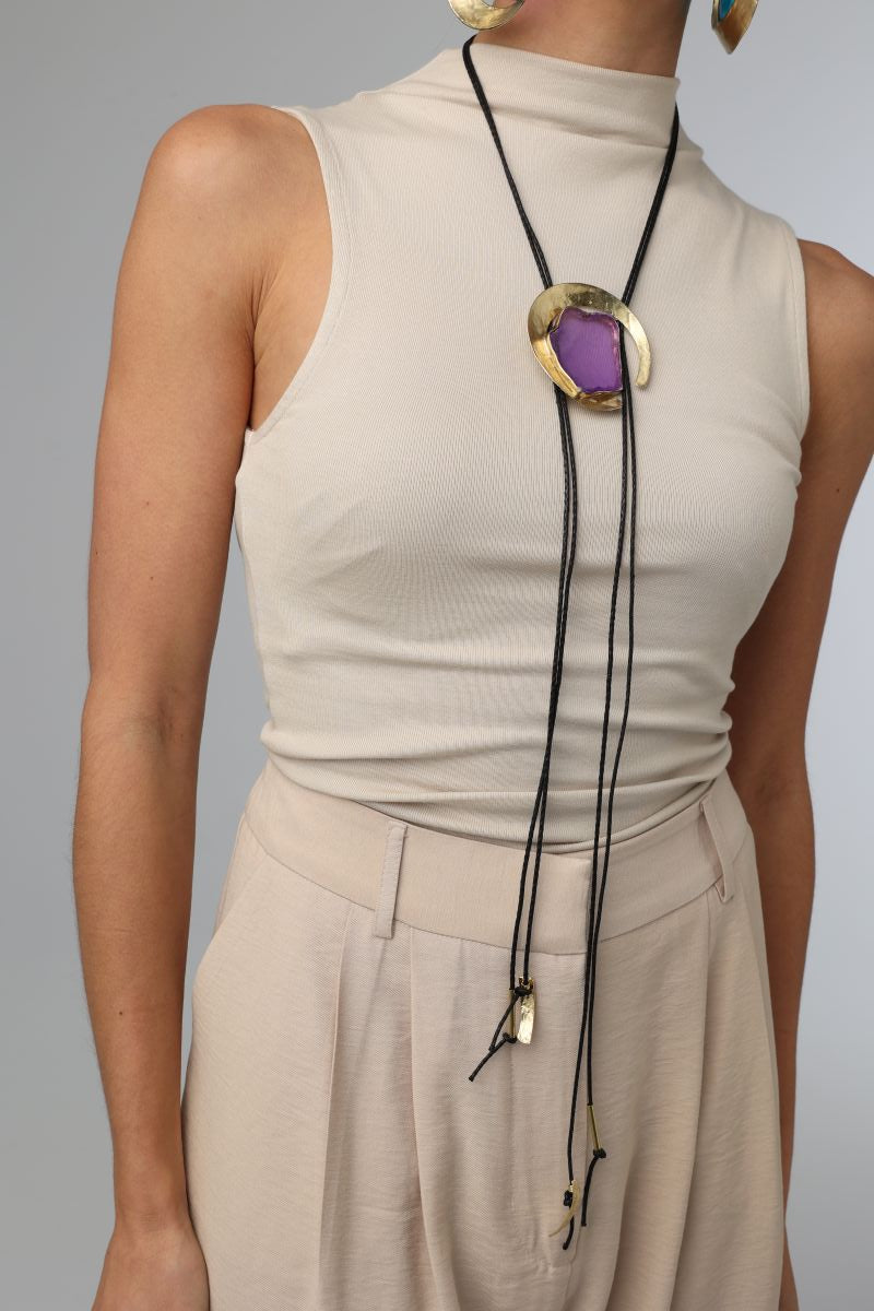 Lucky Lake Necklace — handmade brass bolo necklace with raw gemstone crescent pendant, worn on model