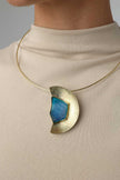 Pond Necklace — handmade brass large semicircle pendant necklace with raw stone on model, full chest view