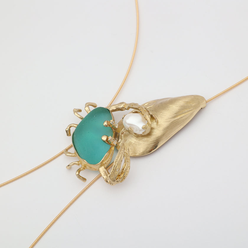 Claw Crabby Necklace — handmade brass crab pendant necklace with resin stone and mussel shell on white background